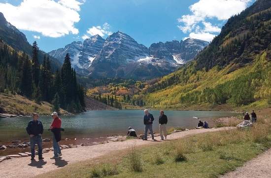Summertime visitors dot the shores of Maroon Lake